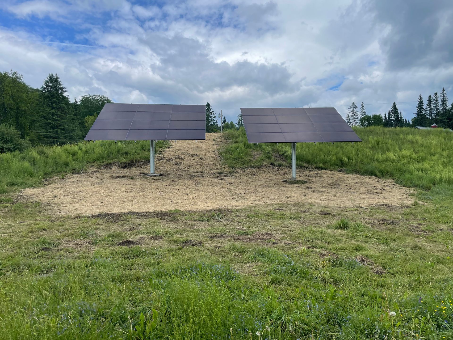 Solar panels installed on a post in a field