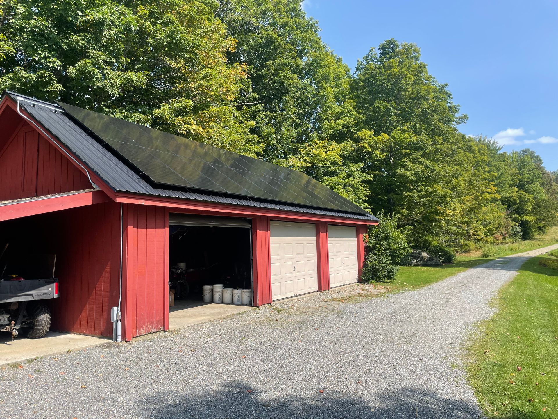 A garage with solar panels installed on the roof