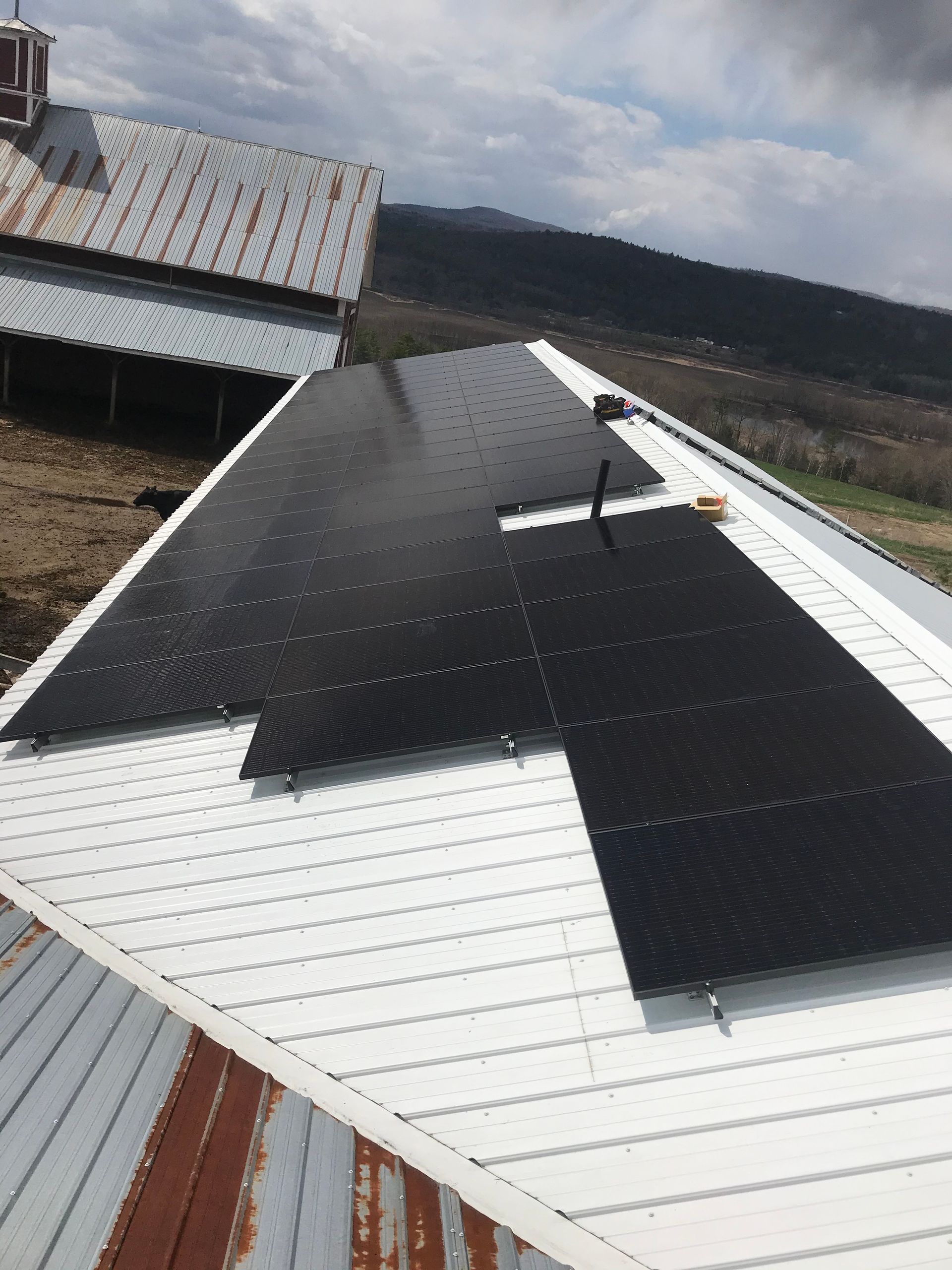 Commercial building recently installed solar panels on a roof