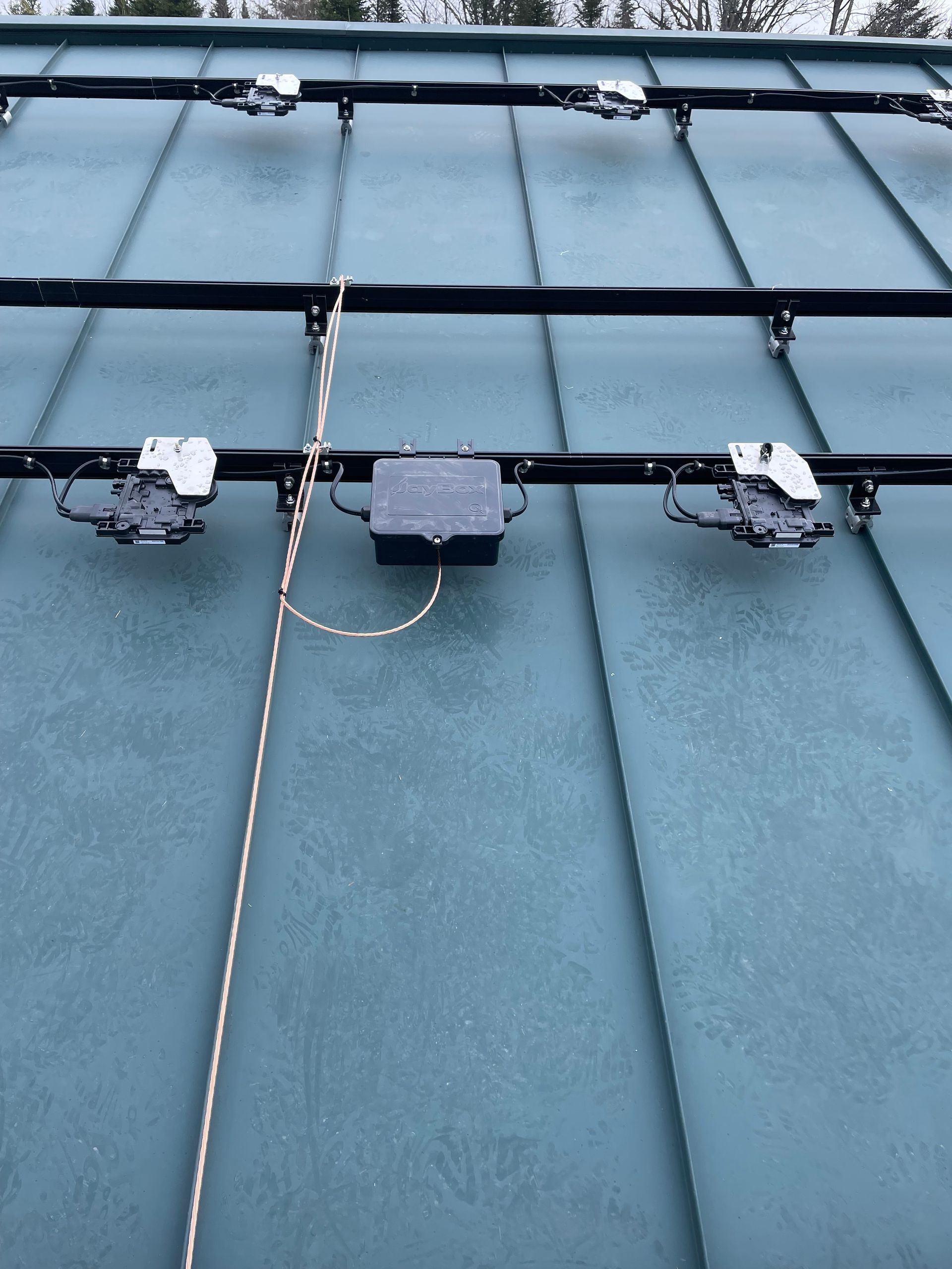 Brackets installed on a roof, getting ready for the panels