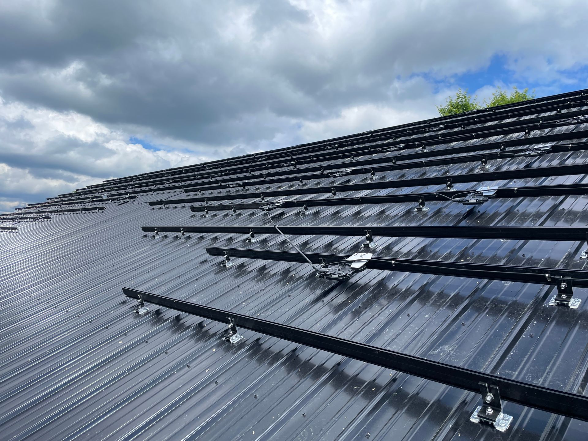 Installing solar panels on a roof, brackets are on