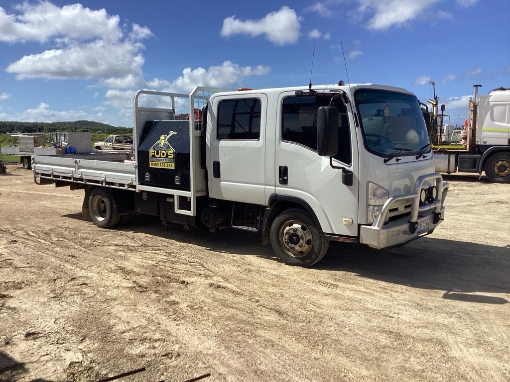 Construction Site With Concrete Forms, Rebar, Workers With Hard Hats — Fud's Concreting In Bowen, QLD
