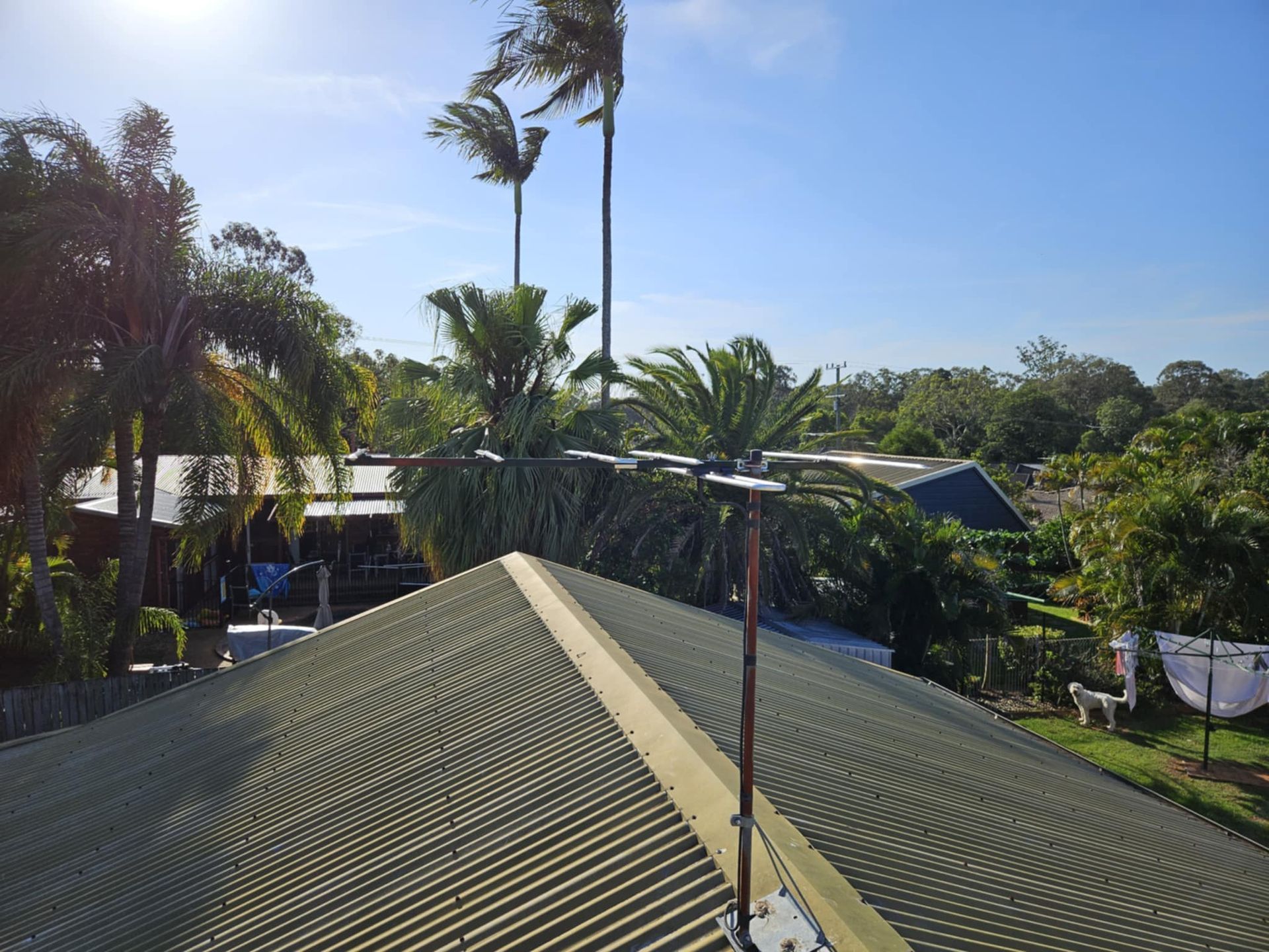 A Picture Of A Roof With A Tower Installed On It— Brisbane Antenna Specialists in Brendale, QLD