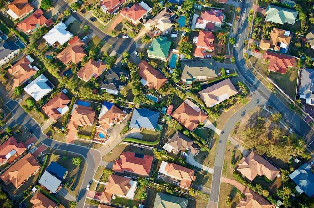 An Aerial View of a Residential Area With Lots of Houses and Trees — Brisbane Antenna Specialists in Logan, QLD