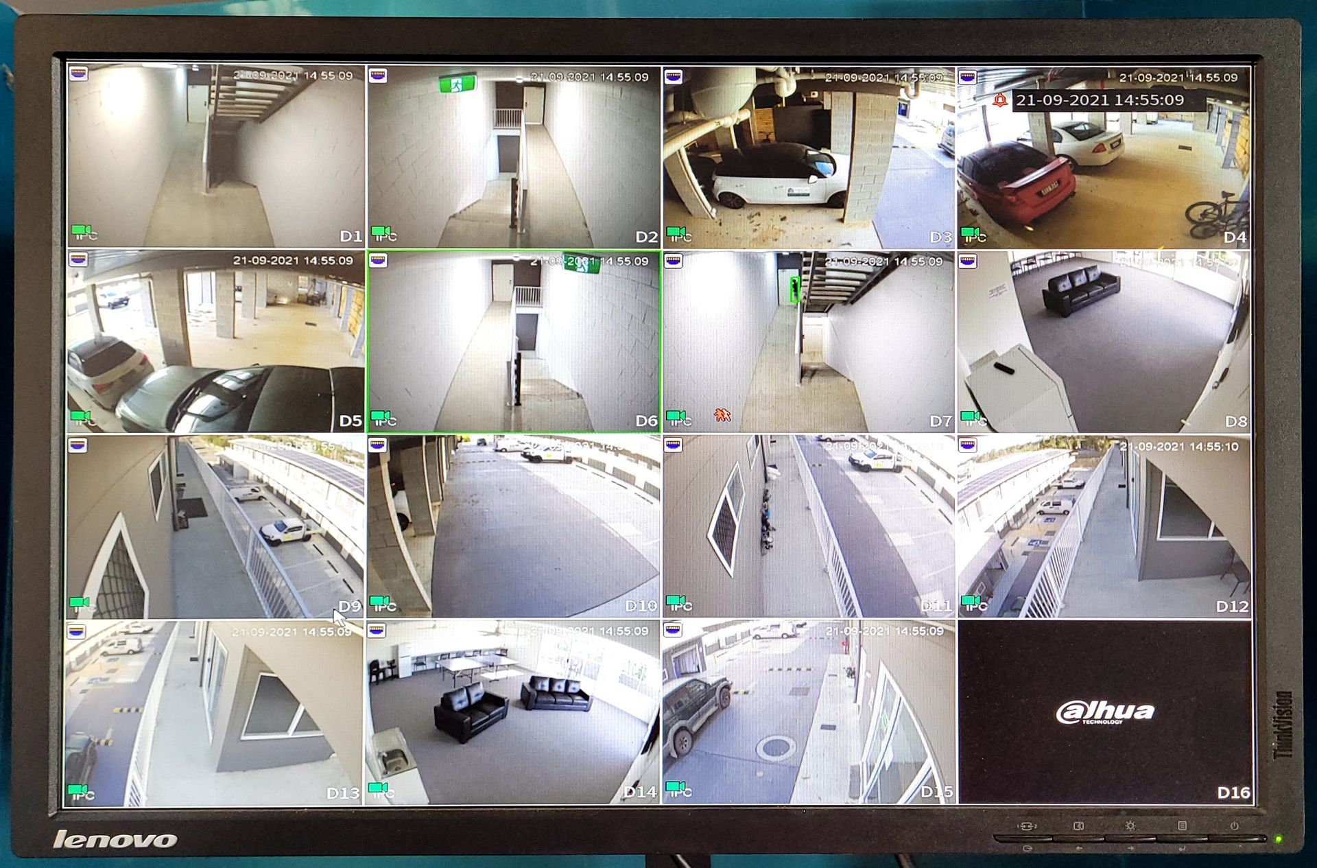 A Man Is Holding A Remote Control While Watching A Movie On A Television — Brisbane Antenna Specialists in Brendale, QLD