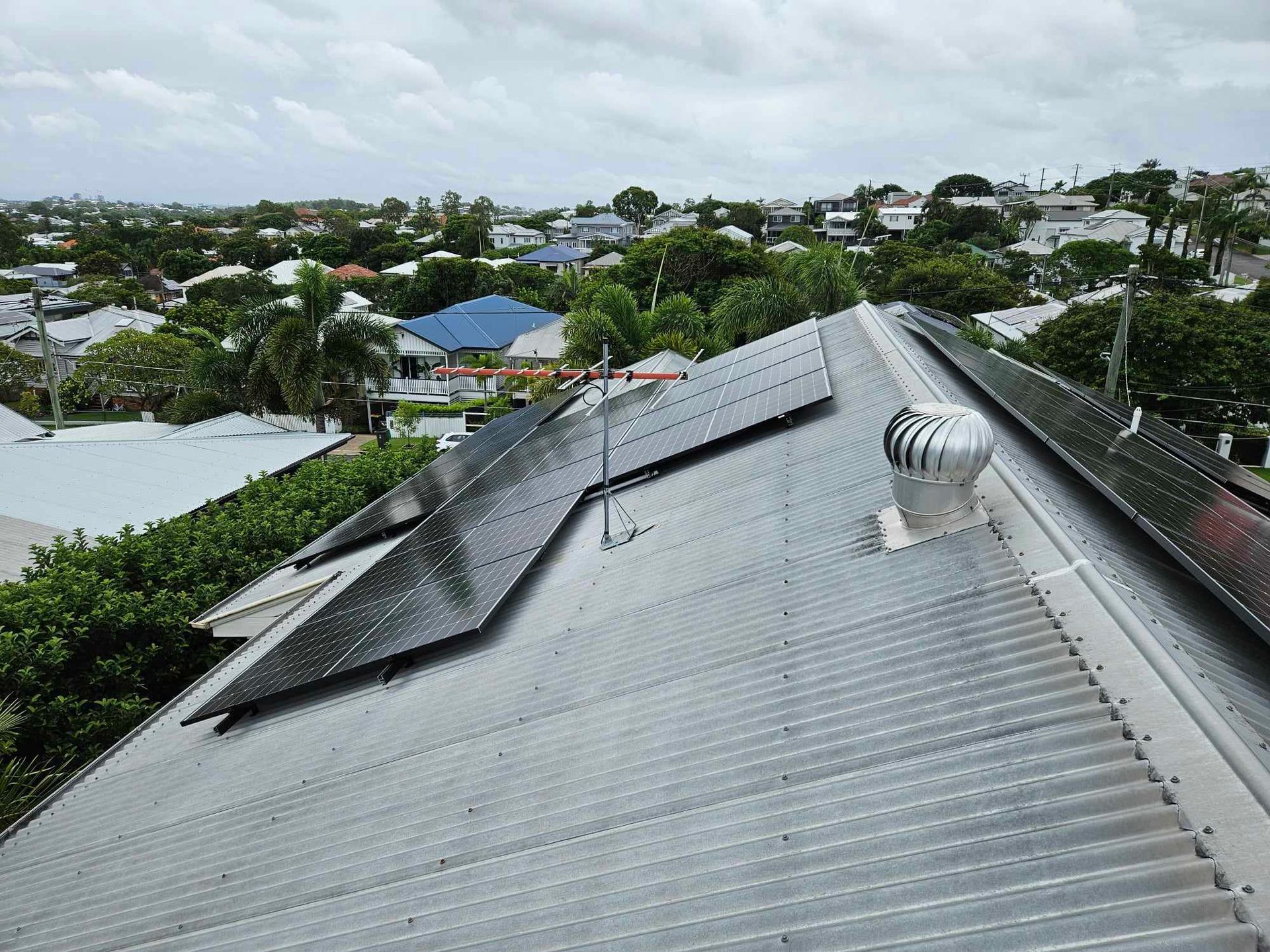 A Solar Panel On Top Of A Pole With A Blue Sky In The Background — Brisbane Antenna Specialists in Brendale, QLD