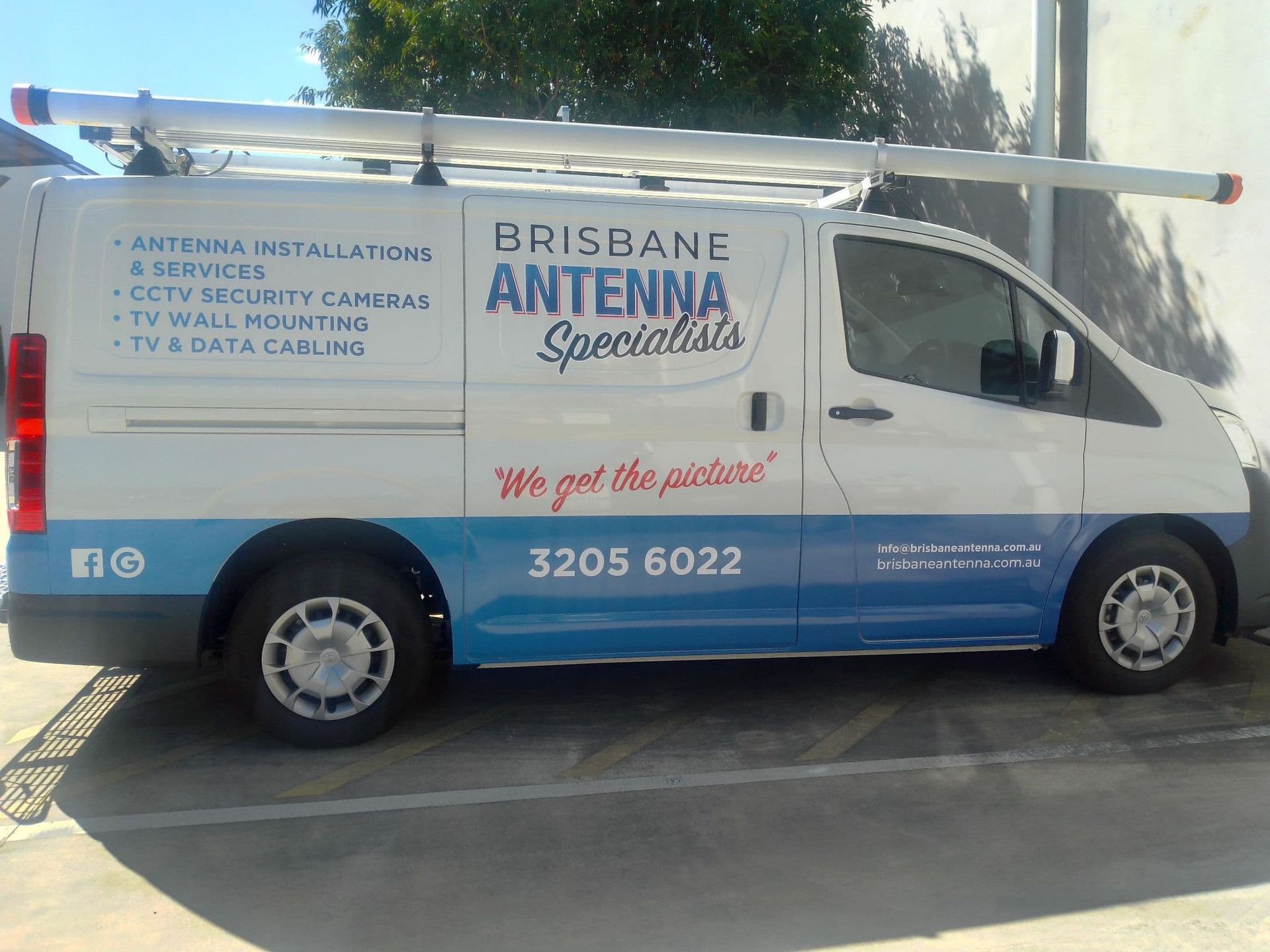 A White Van With a Ladder on Top of It — Brisbane Antenna Specialists in Brendale, QLD