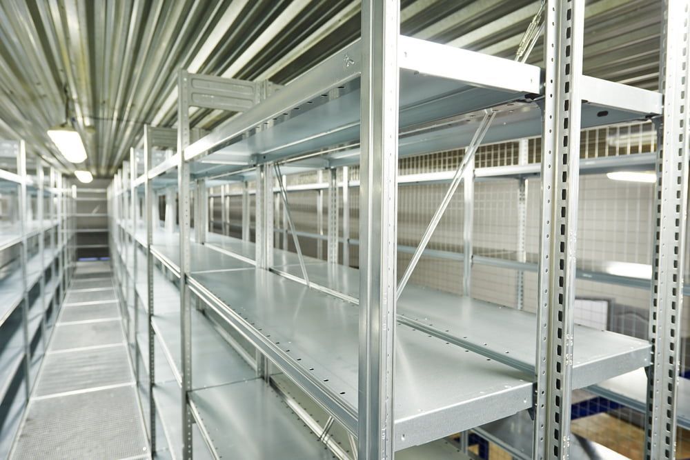 A Long Row of Empty Shelves in A Warehouse — Arctic Installations in Mildura, VIC
