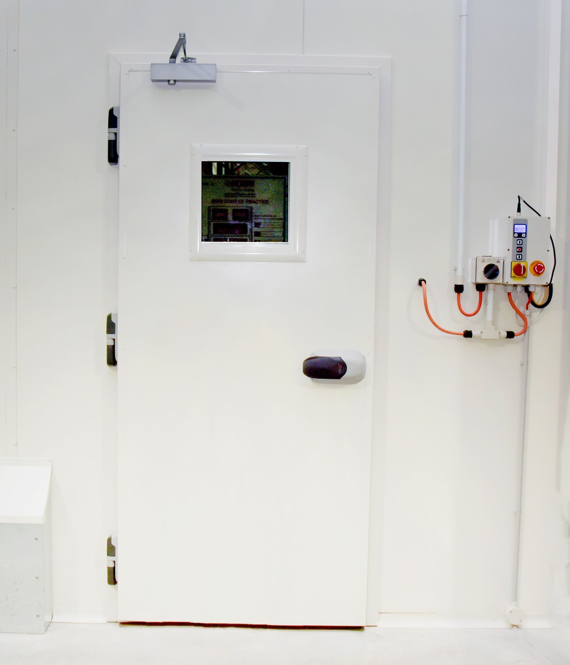 A Couple of White Doors in A Room with A Red Floor — Arctic Installations in Winnellie, NT