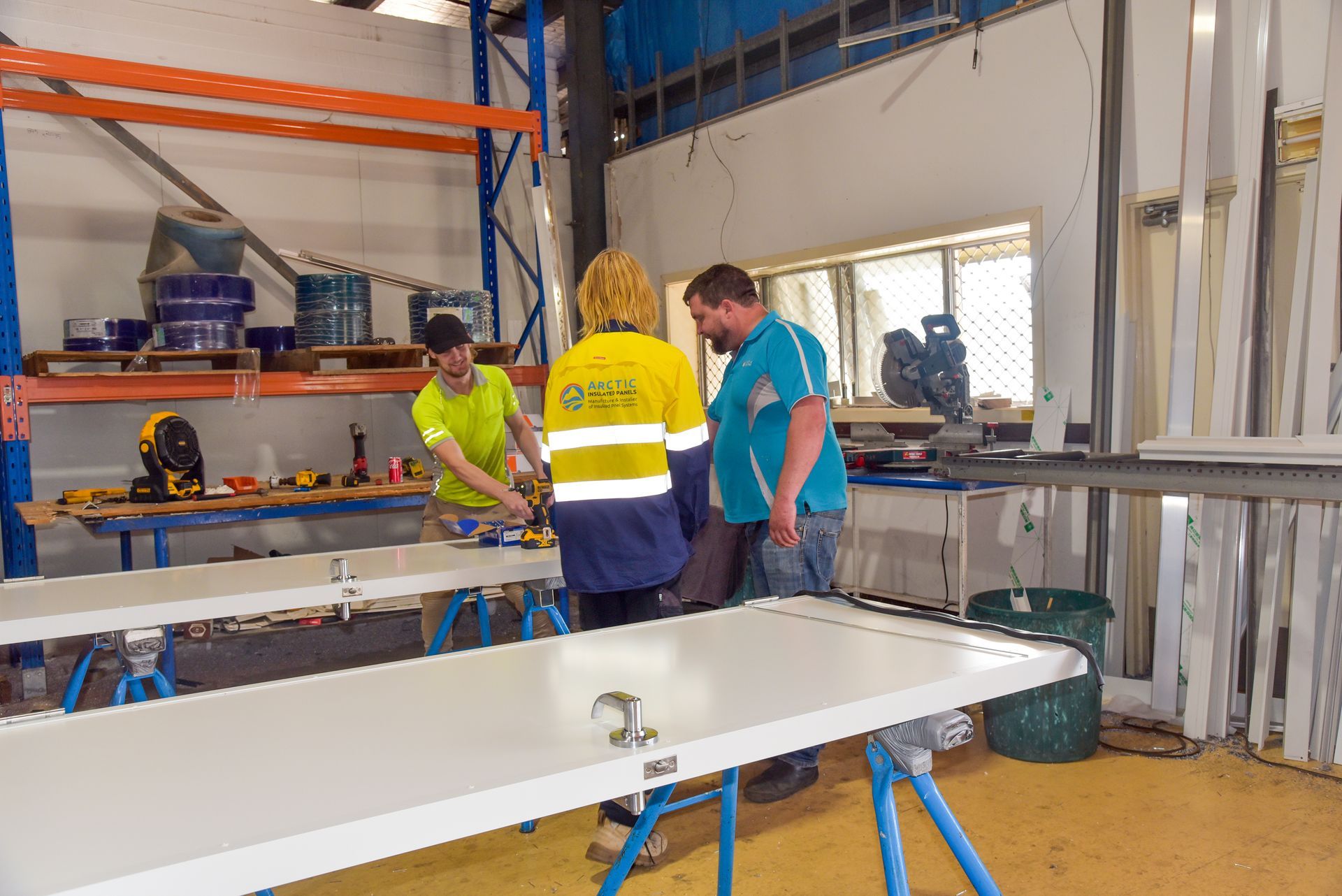 Three Men In A Work Shop — Arctic Installations in Winnellie, NT