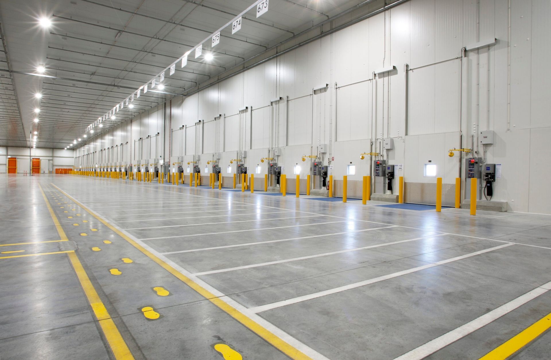 A Row of Empty Shelves in A Warehouse — Arctic Installations in Winnellie, NT