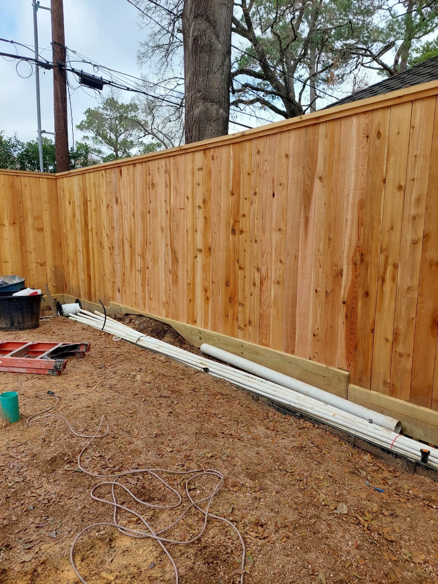 A Wooden Fence Is Being Built in A Backyard - Houston, TX - Rio Grande Fence Company