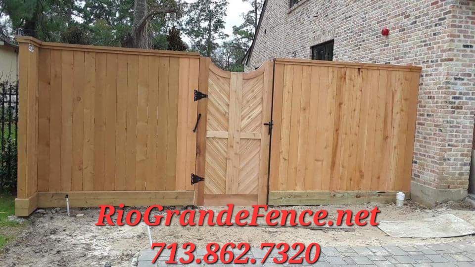 A Wooden Fence with A Gate in Front of A Brick Building - Houston, TX - Rio Grande Fence Company