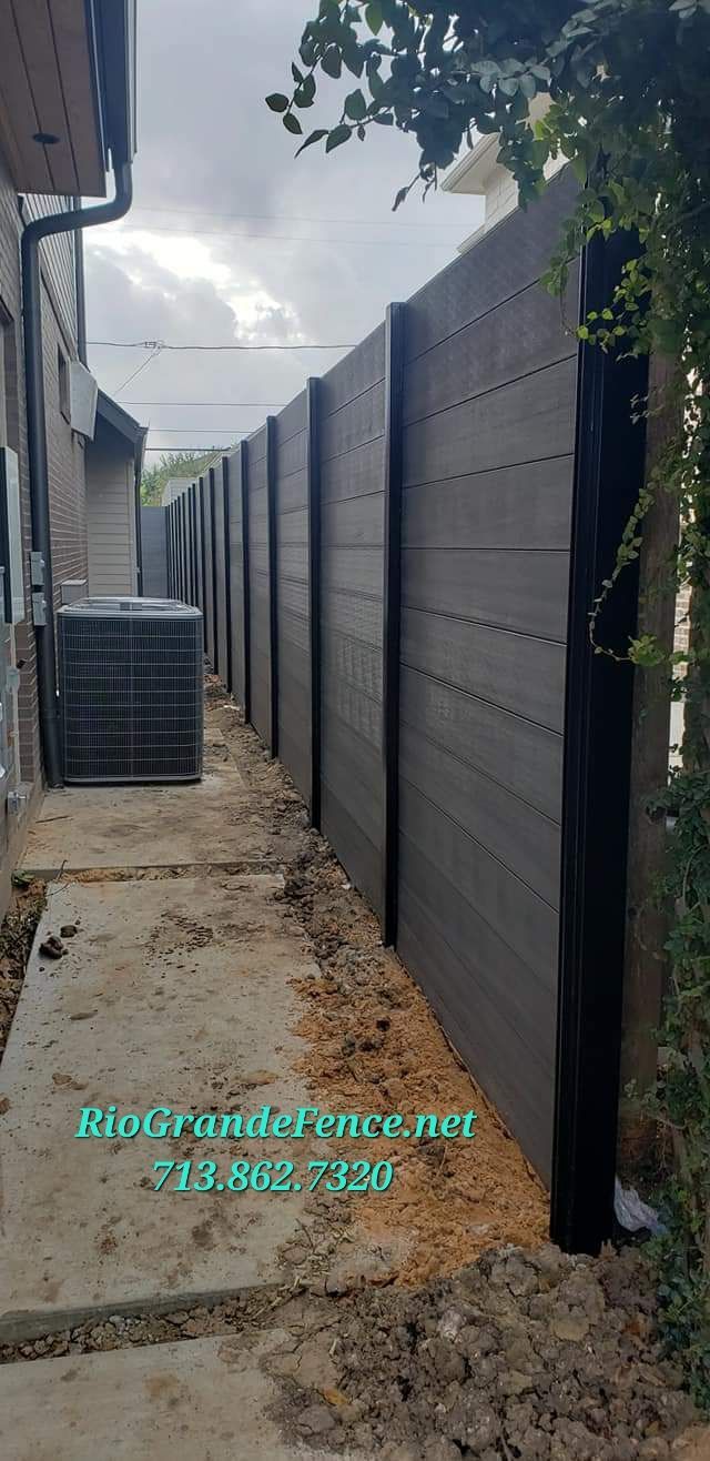 A Fence Is Being Built in The Backyard of A House - Houston, TX - Rio Grande Fence Company