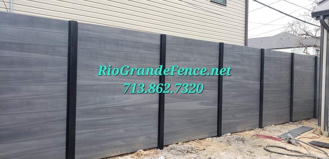 A Black Fence Is Being Built in Front of A House - Houston, TX - Rio Grande Fence Company