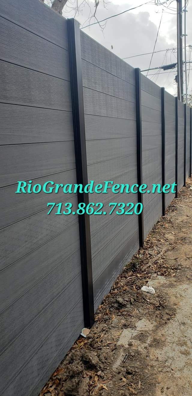 A Black Fence Is Sitting Next to A Dirt Road - Houston, TX - Rio Grande Fence Company
