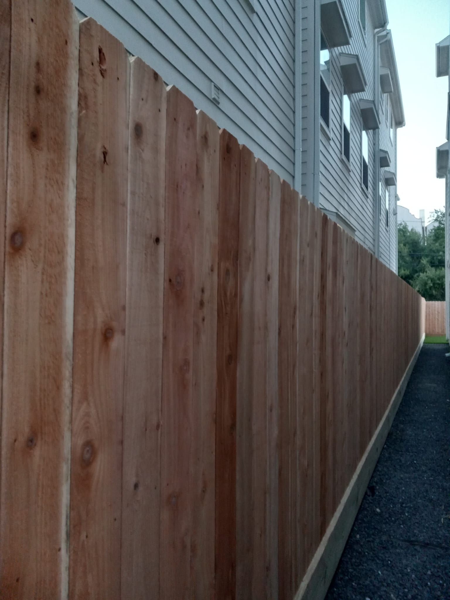 A Wooden Fence Along the Side of A House - Houston, TX - Rio Grande Fence Company