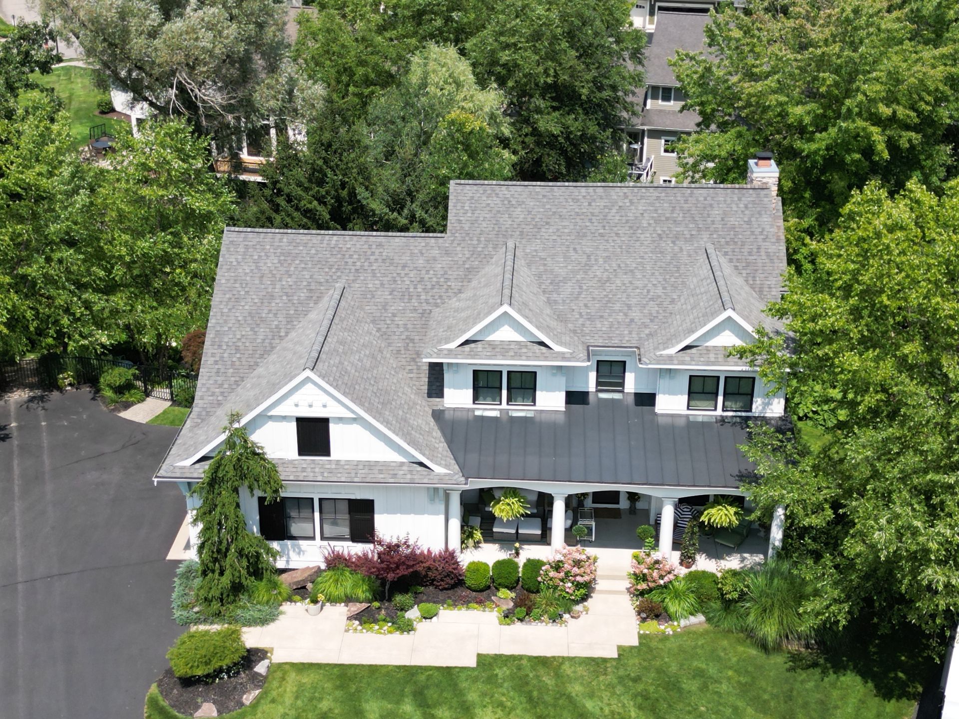 aerial drone photo of a house with a roof completed by top shelf construction and consulting