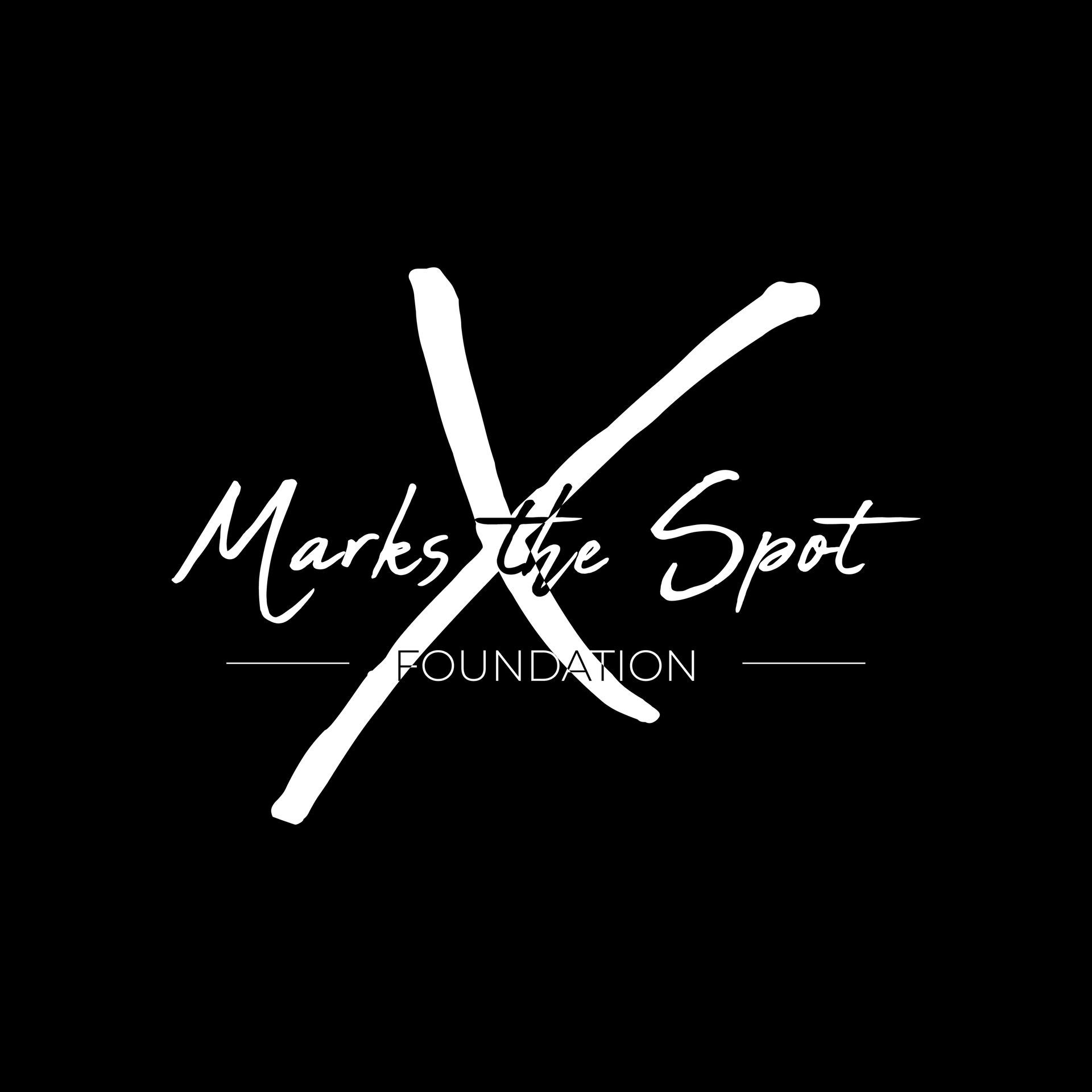 The logo for marks the spot foundation is white on a black background.