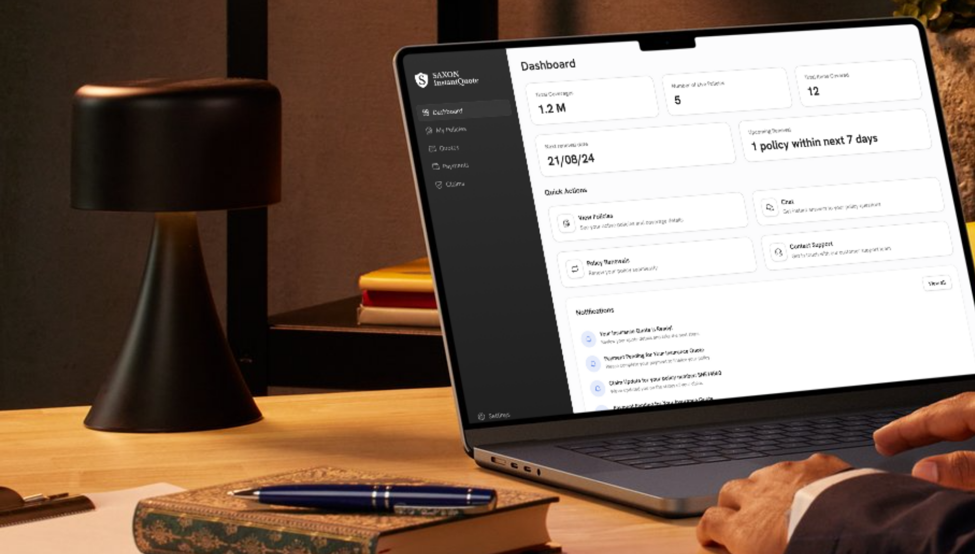 A person is using a laptop computer on a desk.