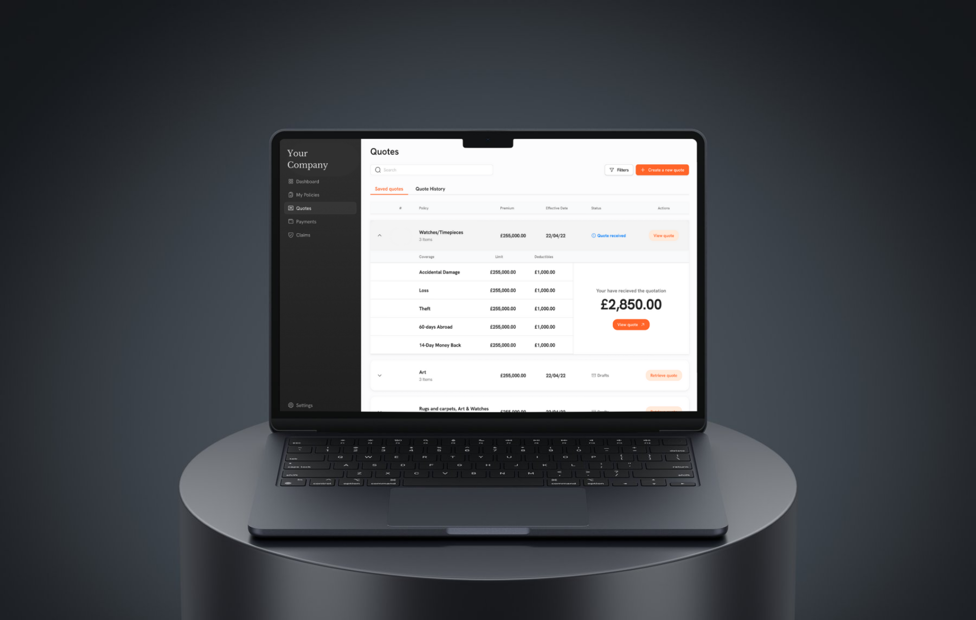 A laptop computer is sitting on top of a round table.