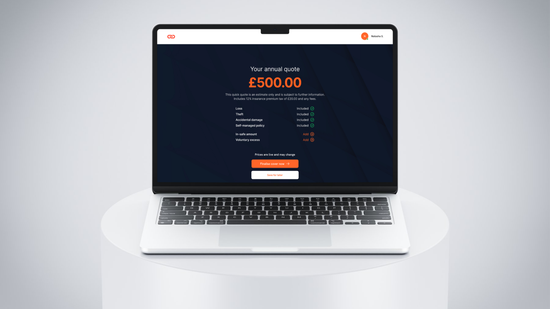 A laptop computer is sitting on a white table