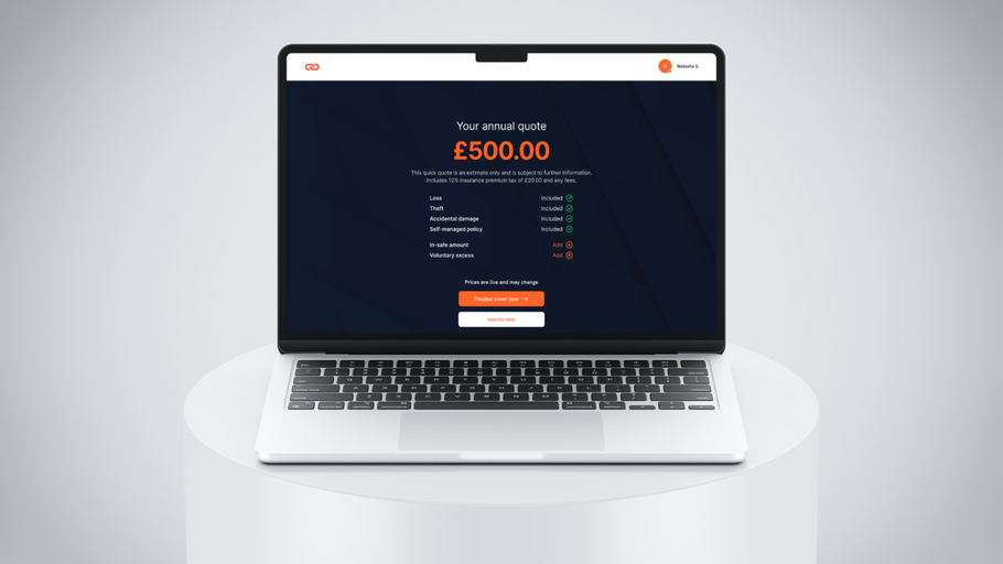 A laptop computer is sitting on a white table