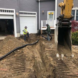 A residential driveway installation in Canton MA - Norfolk Asphalt Paving & Excavation hard at work