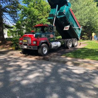 Norfolk Asphalt Paving & Execution delivering materials for an asphalt service in Canton, MA
