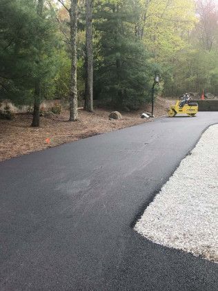 An asphalt driveway construction in Canton, MA by Norfolk Asphalt Paving & Excavation 