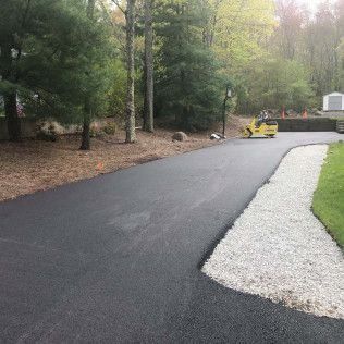 A residential asphalt driveway installation in Canton MA by Norfolk Asphalt Paving & Excavation