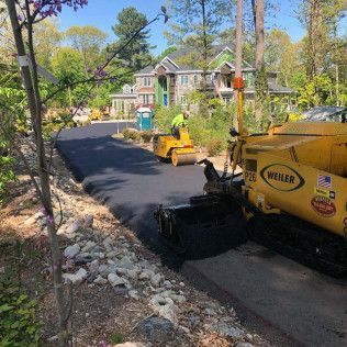 A residential driveway installation in Canton MA - Norfolk Asphalt Paving & Excavation hard at work