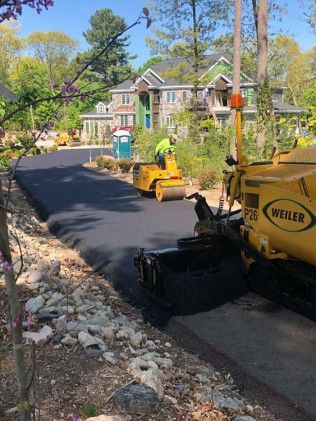An asphalt driveway construction in Canton, MA by Norfolk Asphalt Paving & Excavation 