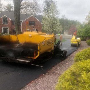A residential driveway installation in Canton MA - Norfolk Asphalt Paving & Excavation hard at work