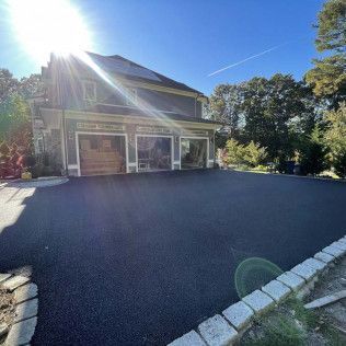 A residential asphalt driveway in Canton MA by Norfolk Asphalt Paving & Excavation