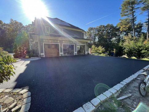 An asphalt driveway construction in Canton, MA by Norfolk Asphalt Paving & Excavation 