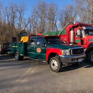 The Norfolk Asphalt Paving & Excavation service trucks in Canton, MA