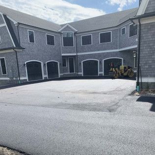A residential asphalt driveway in Canton MA by Norfolk Asphalt Paving & Excavation