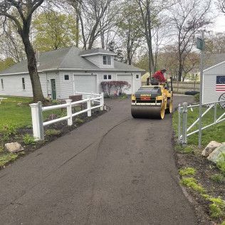 A residential driveway installation in Canton MA - Norfolk Asphalt Paving & Excavation hard at work