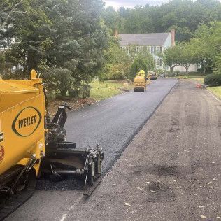 A residential driveway installation in Canton MA - Norfolk Asphalt Paving & Excavation hard at work