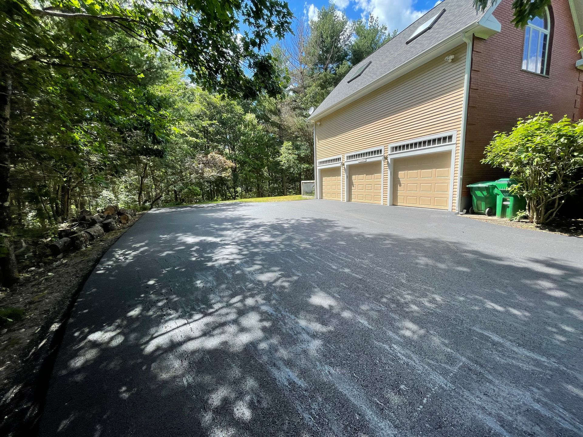 A residential asphalt driveway in Canton MA by Norfolk Asphalt Paving & Excavation