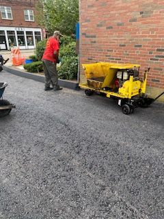 A residential driveway installation in Canton MA - Norfolk Asphalt Paving & Excavation hard at work
