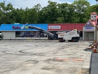 A before shot of an commercial asphalt parking lot in Canton, MA by Norfolk Asphalt Paving & Excavation 