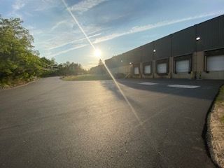 An after shot of a commercial asphalt service in Canton, MA by Norfolk Asphalt Paving & Excavation