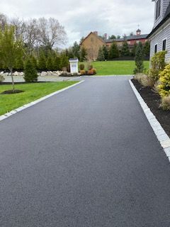 A residential asphalt driveway in Canton MA by Norfolk Asphalt Paving & Excavation