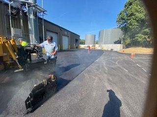 A during shot of a commercial asphalt service in Canton, MA - Norfolk Asphalt Paving & Excavation hard at work