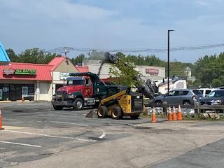 A before shot of an commercial asphalt parking lot in Canton, MA by Norfolk Asphalt Paving & Excavation 