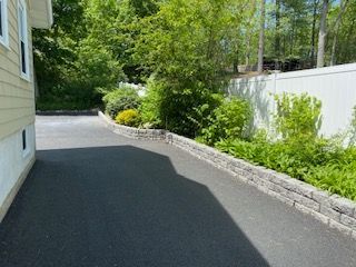 A residential asphalt driveway in Canton, MA by Norfolk Asphalt Paving & Excavation