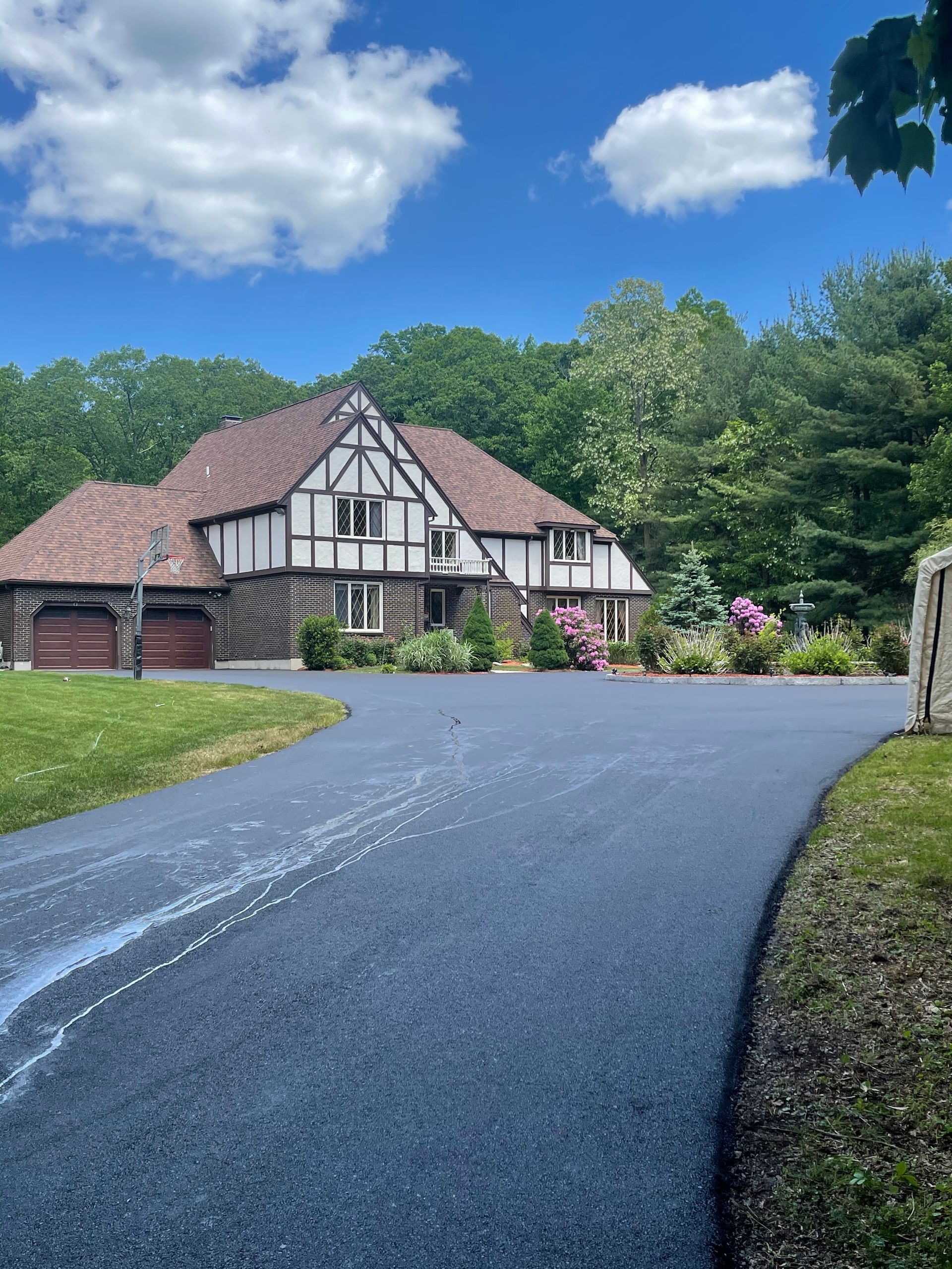 A residential asphalt driveway in Canton MA by Norfolk Asphalt Paving & Excavation