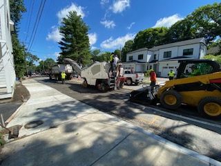 A during shot of a residential asphalt service in Canton, MA - Norfolk Asphalt Paving & Excavation hard at work
